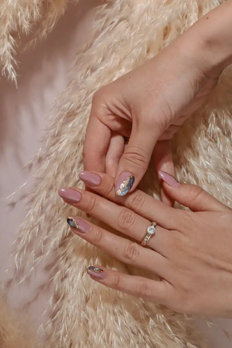 Nude manicure with glitter accent