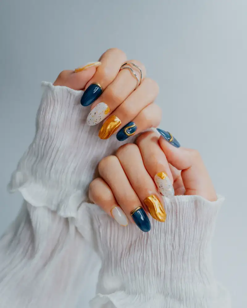 Navy, gold and white nail art