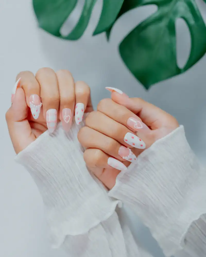 White nails with pink hearts