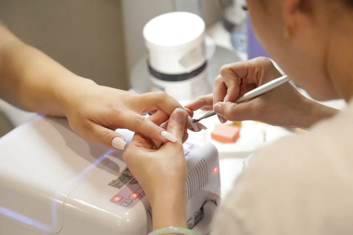 Manicure in progress at BUSINESS NAME